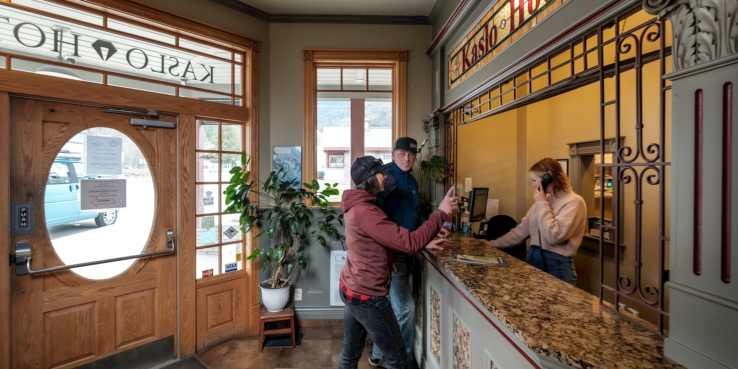 Guests checking in at Front Desk. Kaslo Hotel